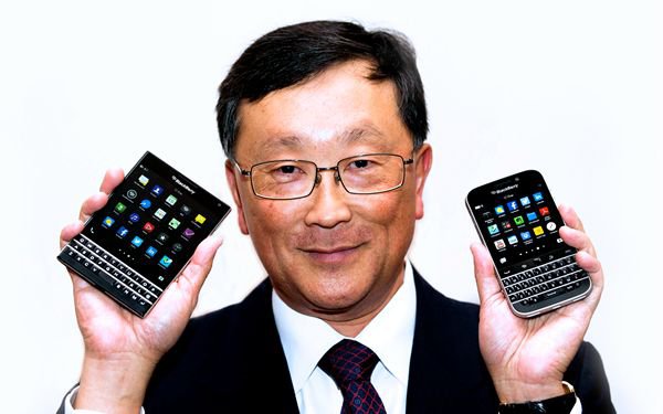 BlackBerry CEO Chen holds up the unreleased Blackberry Passport and Blackberry Classic devices during the company's annual general meeting for shareholders in Toronto